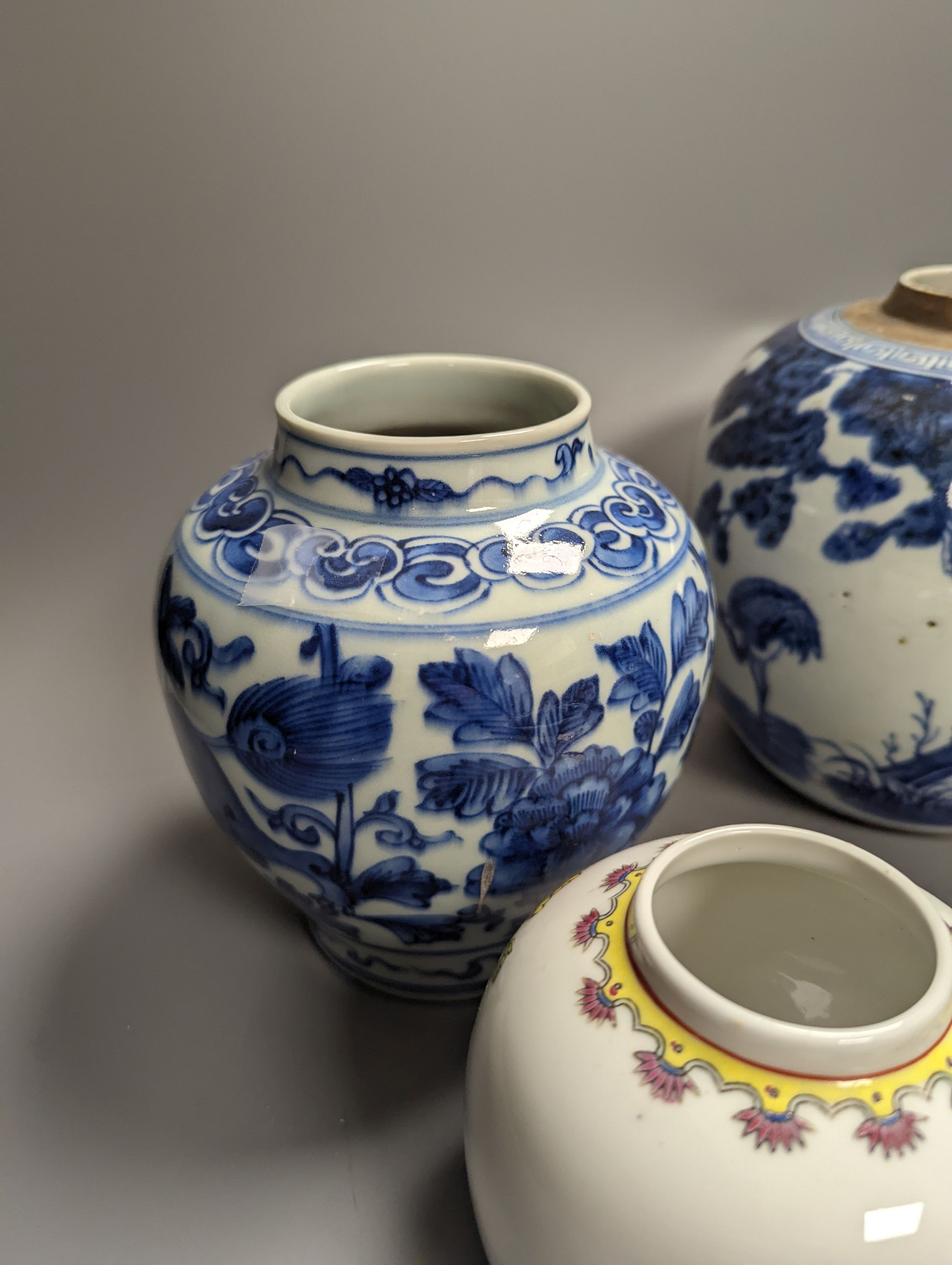 Four Chinese porcelain jars and a delft ware jar, 18cm and a pressed glass powder jar (a.f.)